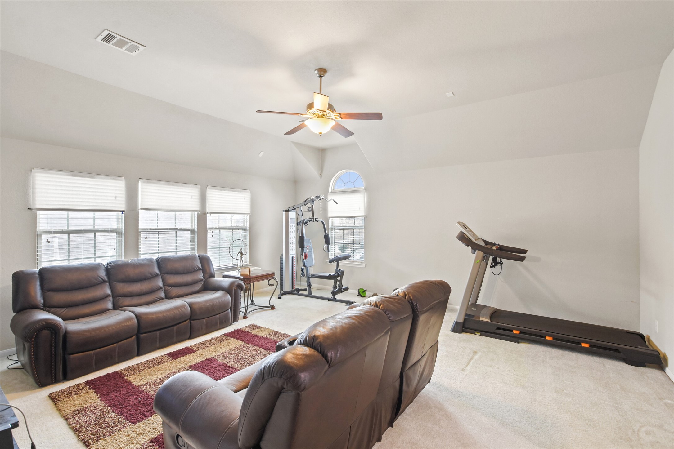 4827 Oak Rambling Drive Katy, TX 77494 - Photo 31 of 45 a living room with furniture a ceiling fan and a window