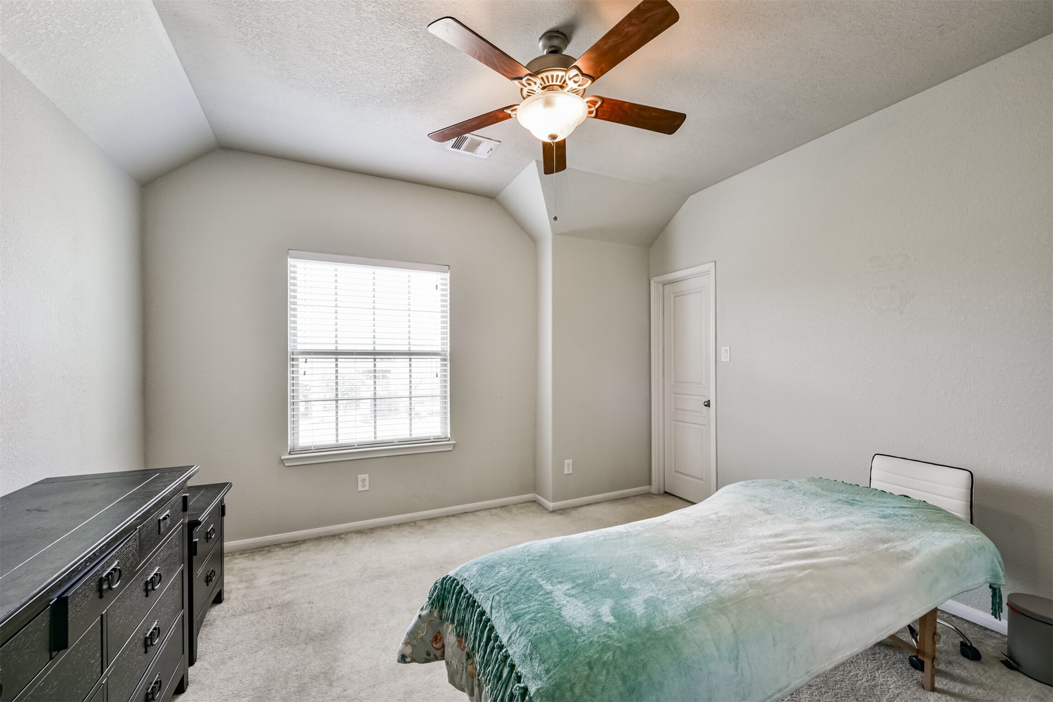 4827 Oak Rambling Drive Katy, TX 77494 - Photo 36 of 45 a bedroom with a bed and a window