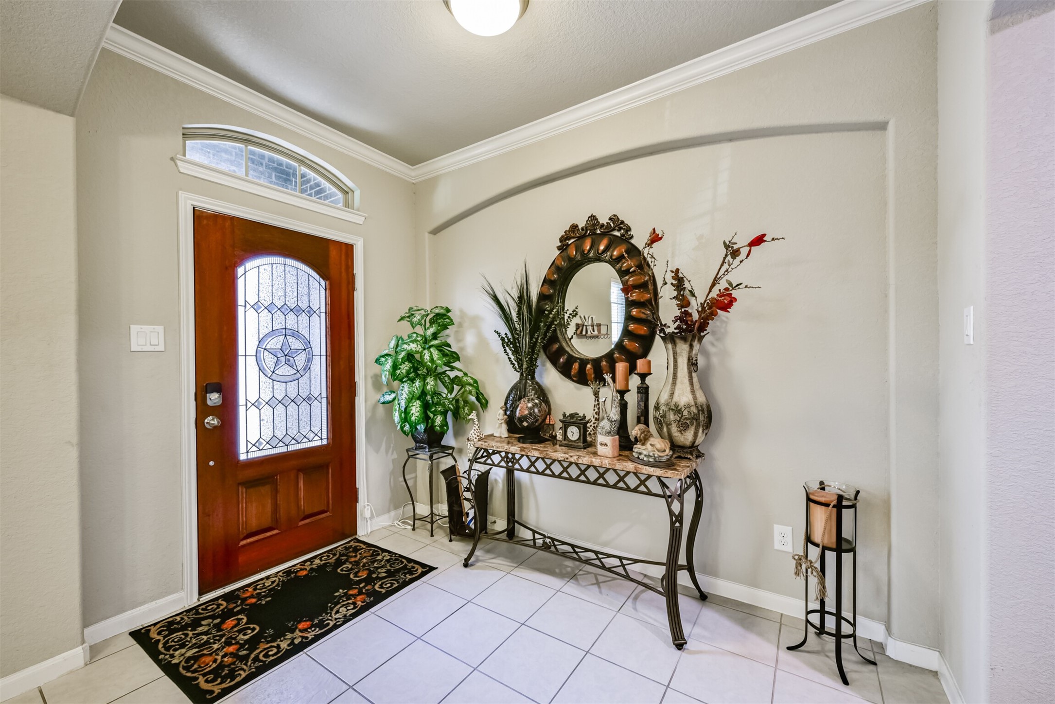4827 Oak Rambling Drive Katy, TX 77494 - Photo 4 of 45 a view of an entryway with a table and chairs
