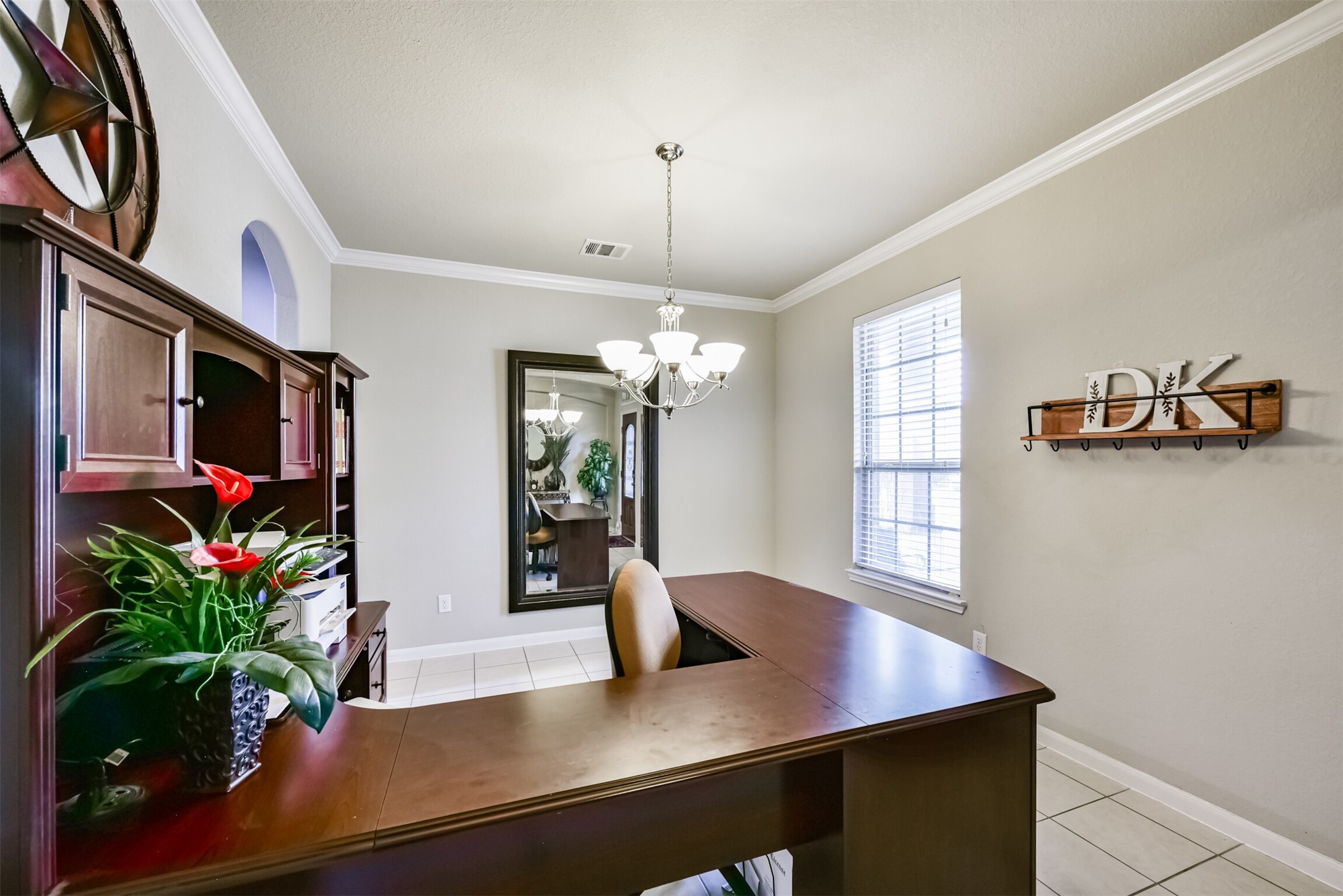 4827 Oak Rambling Drive Katy, TX 77494 - Photo 6 of 45 a view of a dining room with furniture and a potted plant