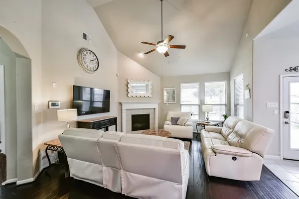 a large kitchen with a large counter top appliances and cabinets