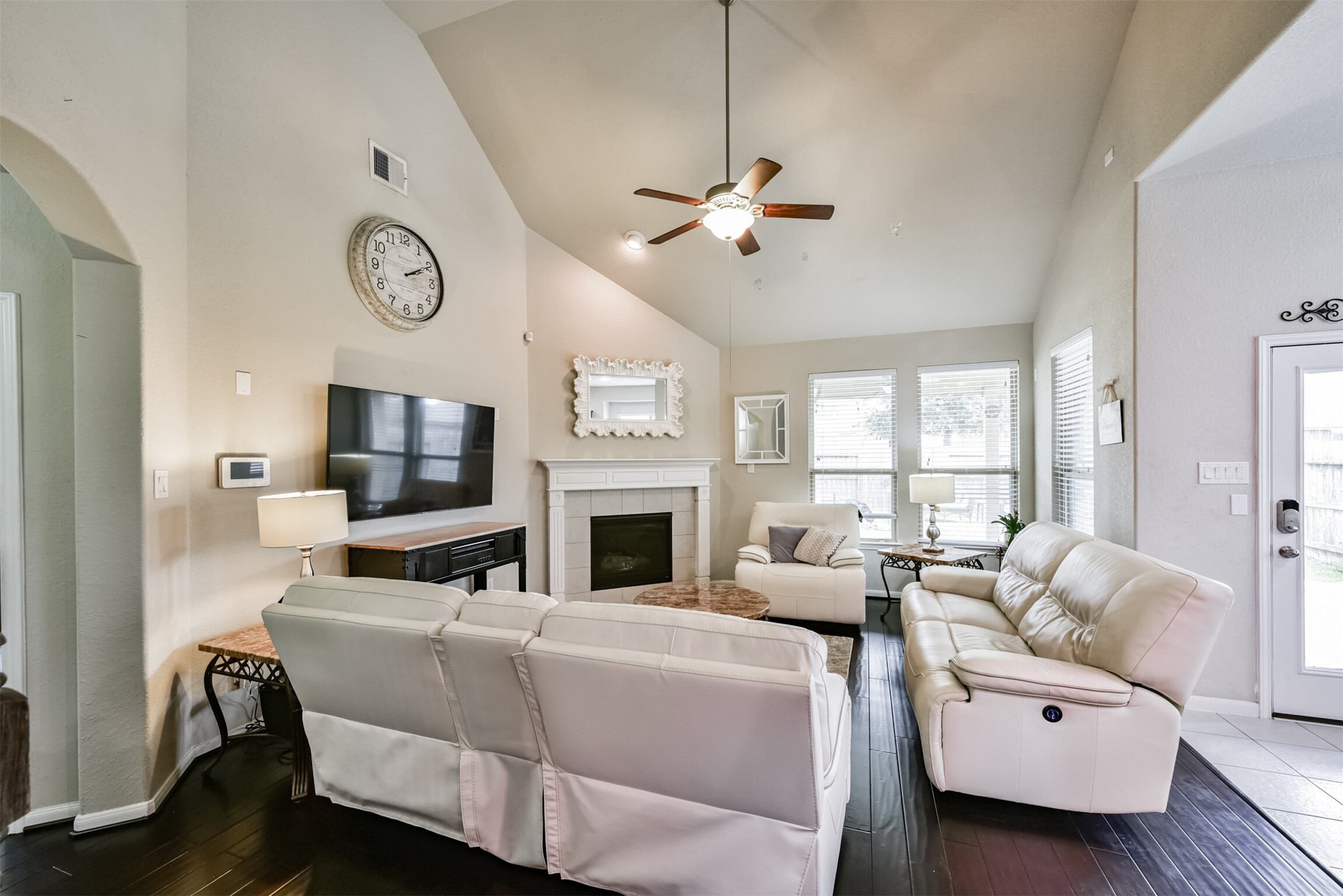 4827 Oak Rambling Drive Katy, TX 77494 - Photo 9 of 45 a living room with furniture a fireplace and a flat screen tv