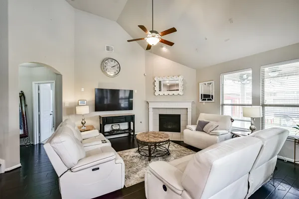 a kitchen with stainless steel appliances kitchen island granite countertop a stove a microwave and cabinets