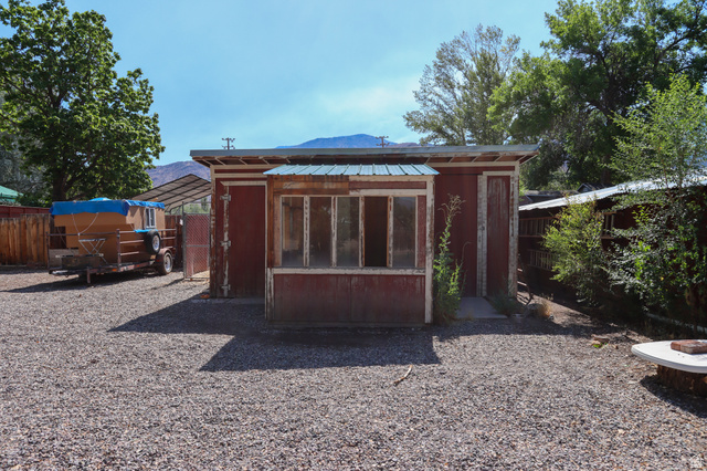 270 East 100 North Monroe, UT 84754 - Photo 50 of 65 Freestanding shed with a red-painted exterior and a multi-pane window