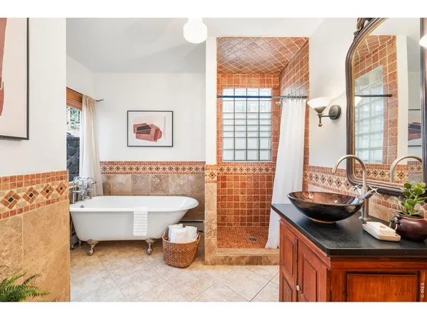 a bathroom with a sink double vanity and a tub