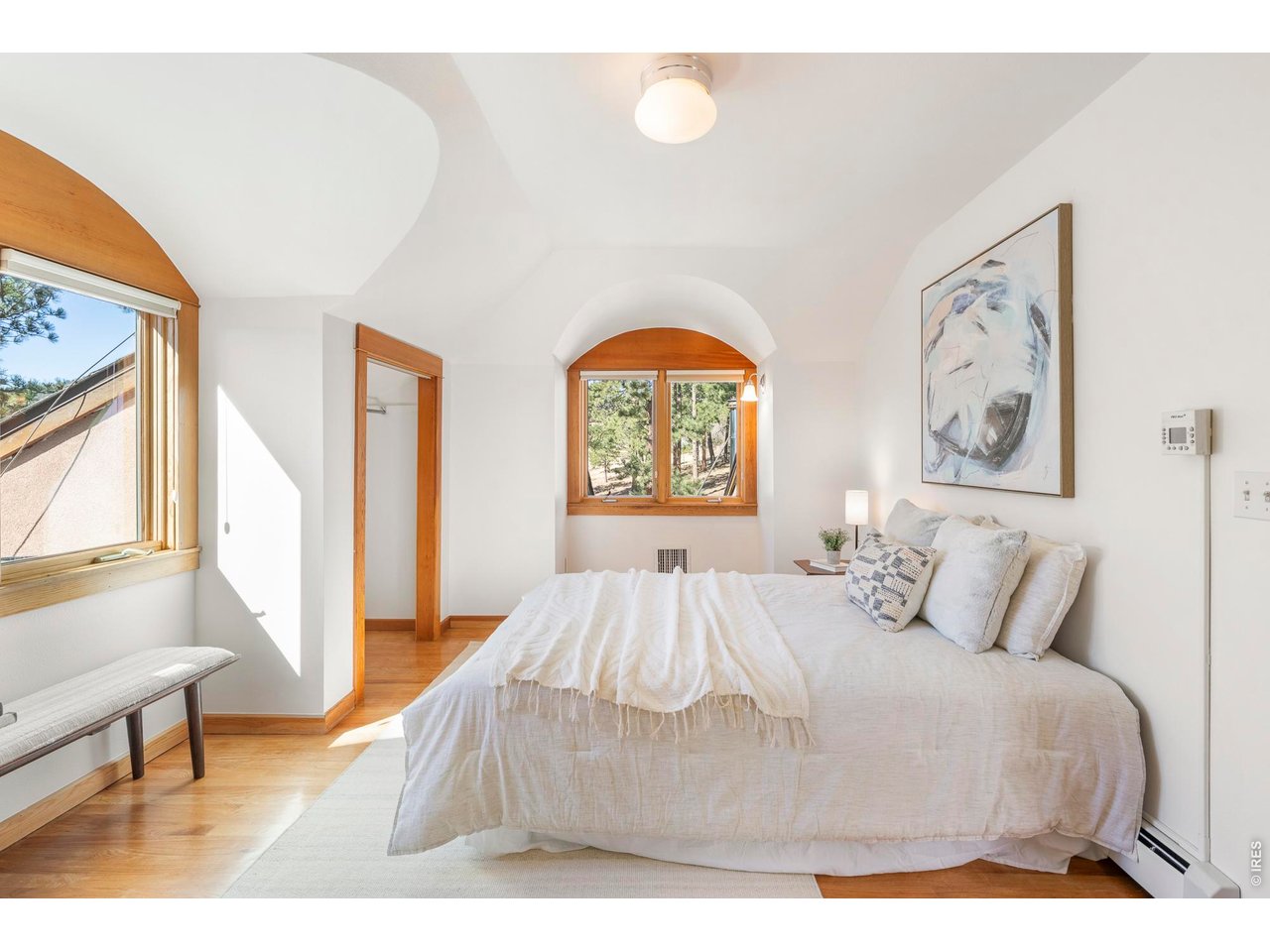 121 Leonards Road Boulder, CO 80302 - Photo 21 of 44 a bedroom with a bed and a large window
