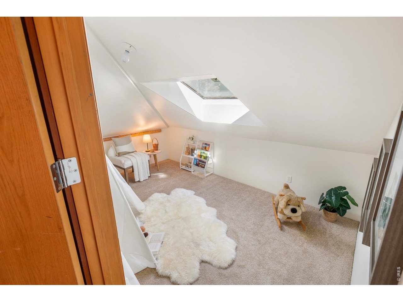 121 Leonards Road Boulder, CO 80302 - Photo 22 of 44 a view of living room with furniture and wooden floor