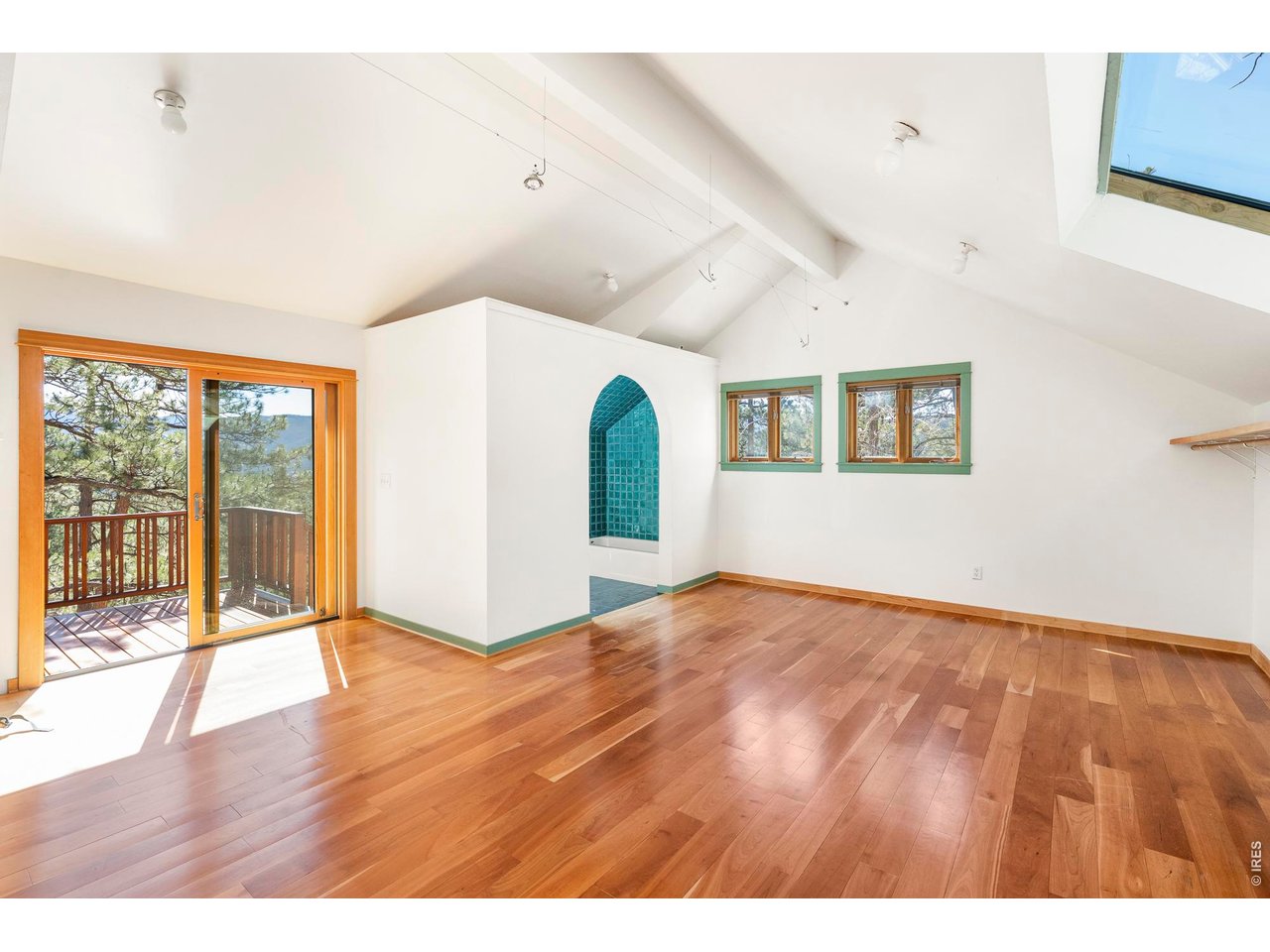 121 Leonards Road Boulder, CO 80302 - Photo 24 of 44 a view of an empty room with wooden floor and a window