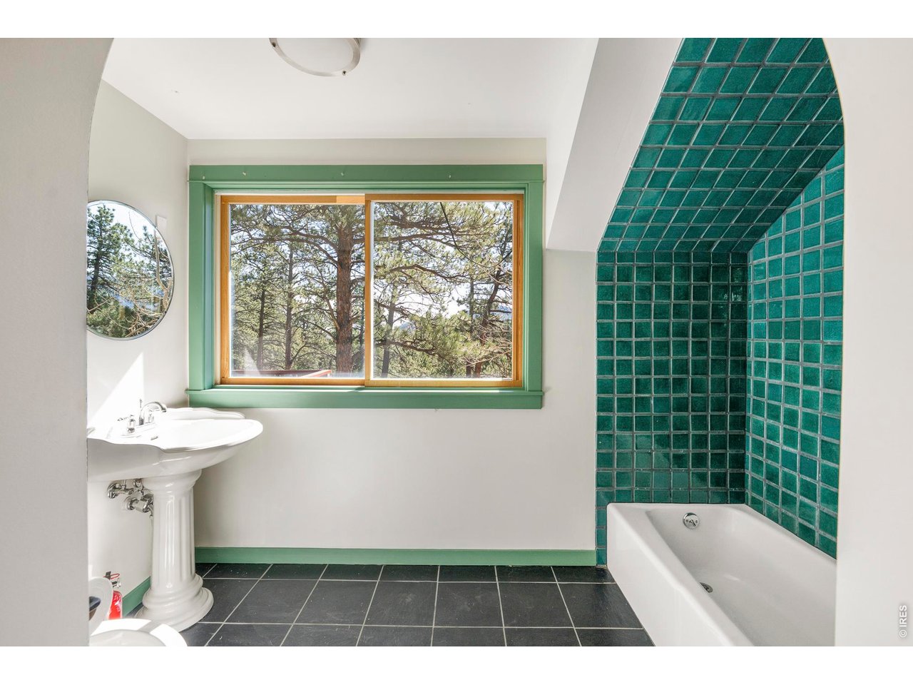 121 Leonards Road Boulder, CO 80302 - Photo 25 of 44 a bathroom with a sink a toilet and window