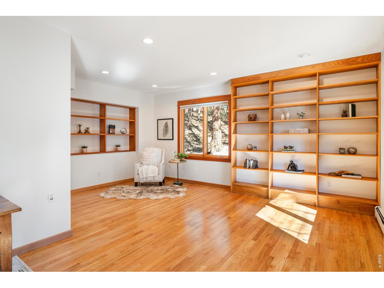 121 Leonards Road Boulder, CO 80302 - Photo 26 of 44 a view of an empty room with window and wooden floor