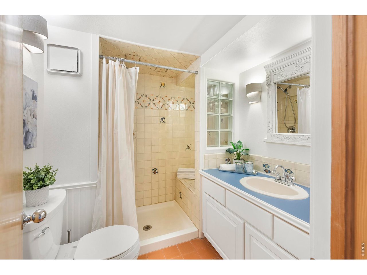 121 Leonards Road Boulder, CO 80302 - Photo 28 of 44 a spacious bathroom with a sink mirror and a shower