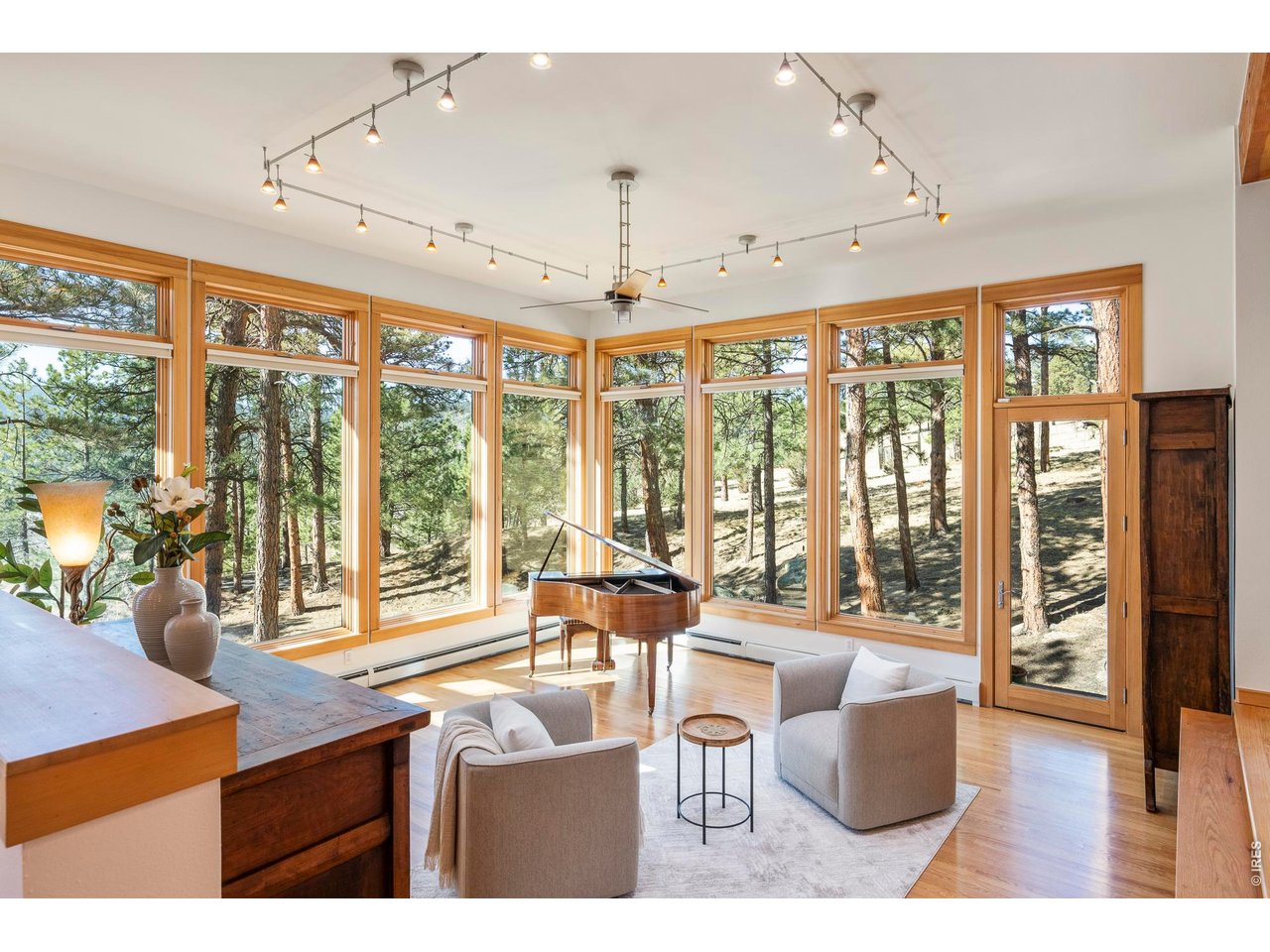 121 Leonards Road Boulder, CO 80302 - Photo 3 of 44 a living room with furniture and large windows