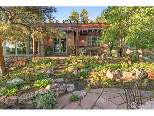 a view of a patio with table and chairs
