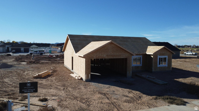 4973 North 900 East Enoch, UT 84721 - Photo 4 of 8 View of front of home featuring a garage and a residential view