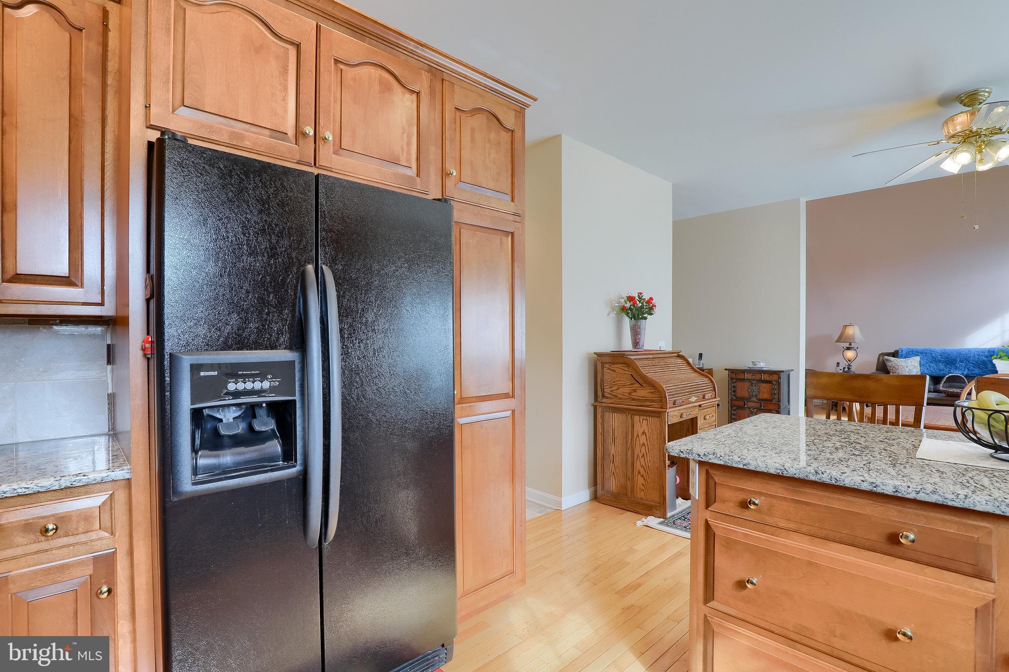 430 Wagonwheel Road Lititz, PA 17543 - Photo 22 of 51 a kitchen with granite countertop stainless steel appliances a refrigerator and counter space