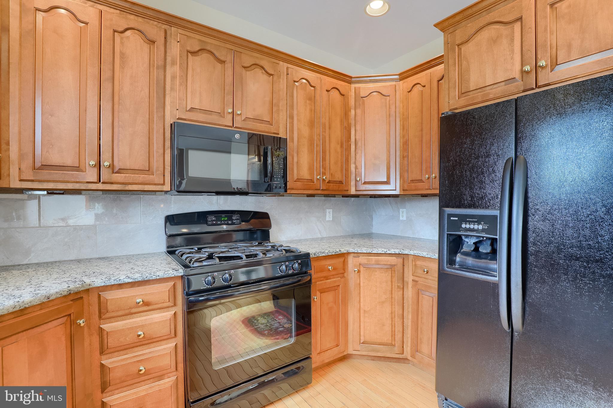 430 Wagonwheel Road Lititz, PA 17543 - Photo 23 of 51 a kitchen with stainless steel appliances granite countertop a refrigerator stove and cabinets
