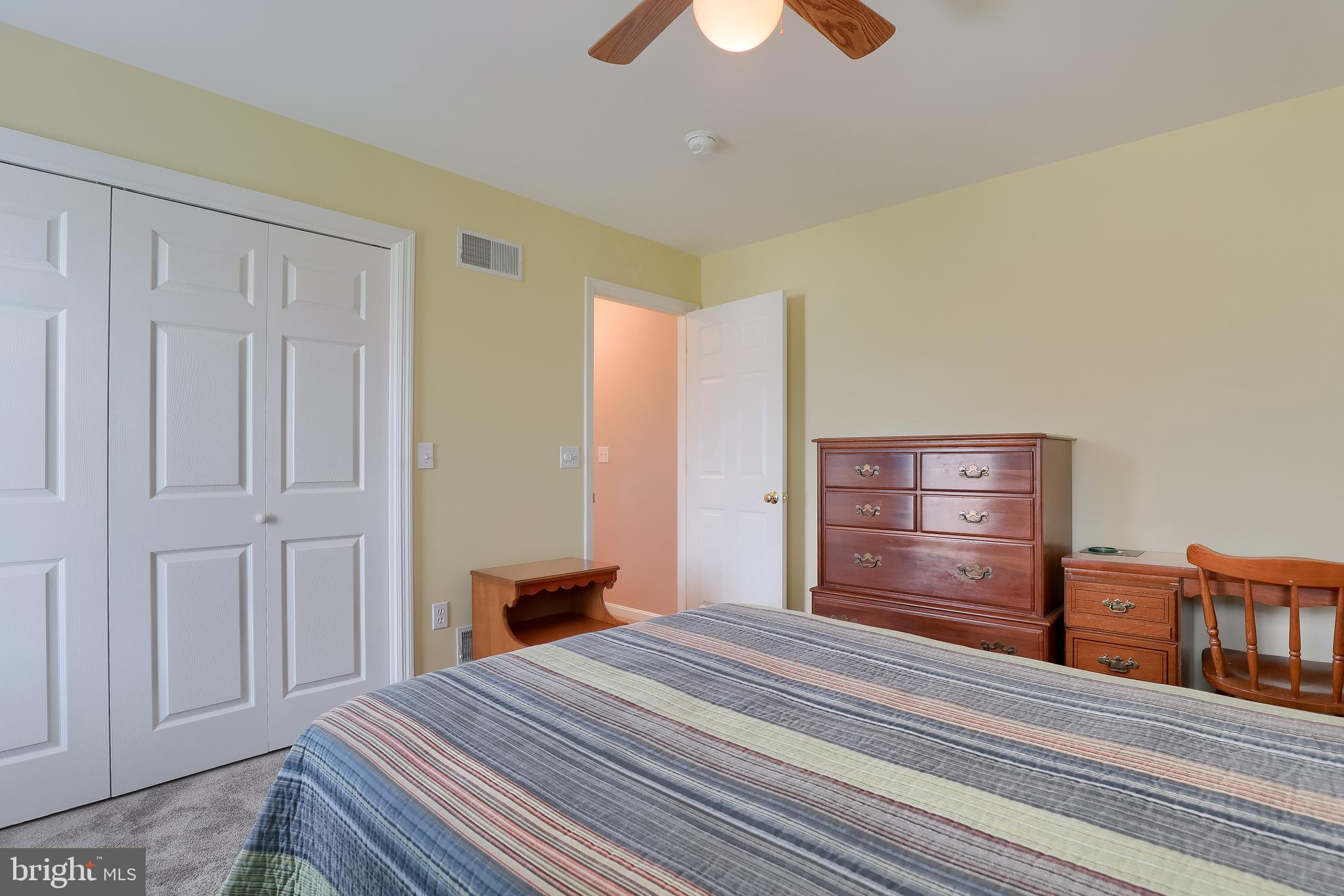 430 Wagonwheel Road Lititz, PA 17543 - Photo 29 of 51 a bedroom with a bed and a chandelier