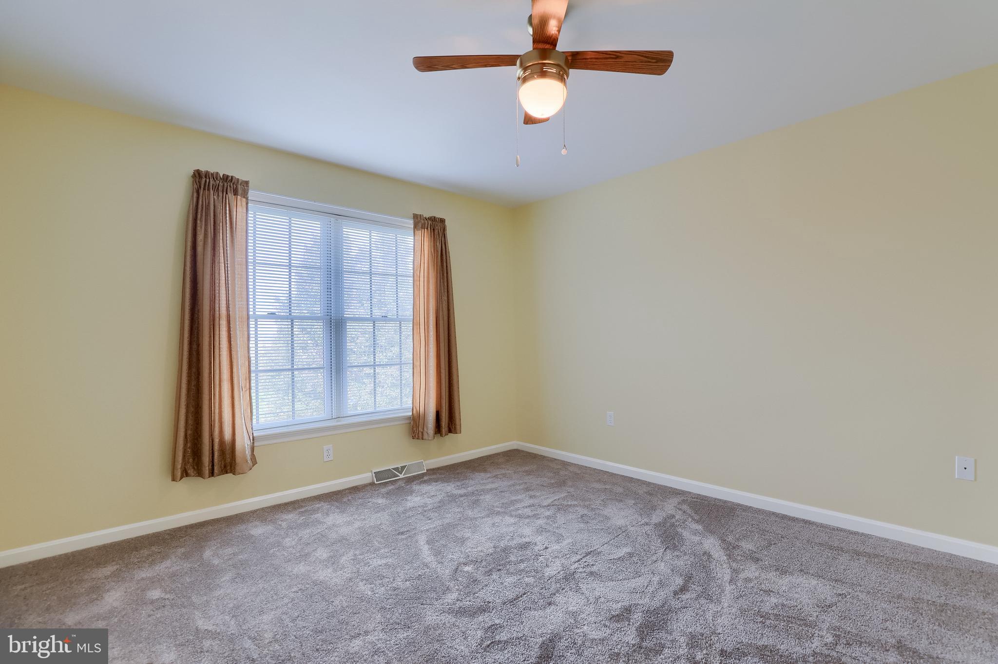 430 Wagonwheel Road Lititz, PA 17543 - Photo 32 of 51 an empty room with windows and fan
