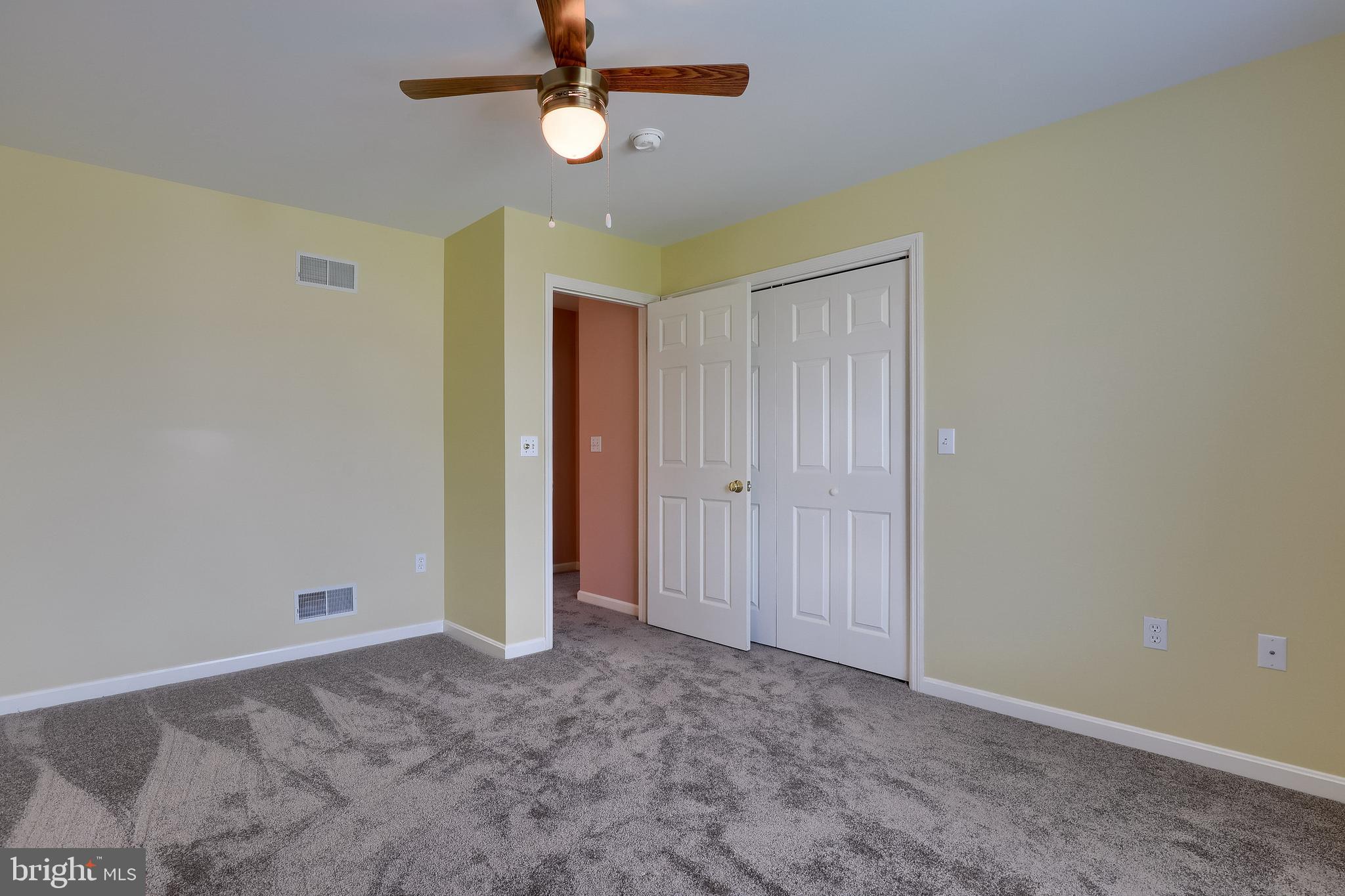430 Wagonwheel Road Lititz, PA 17543 - Photo 33 of 51 an empty room with a ceiling fan and a window