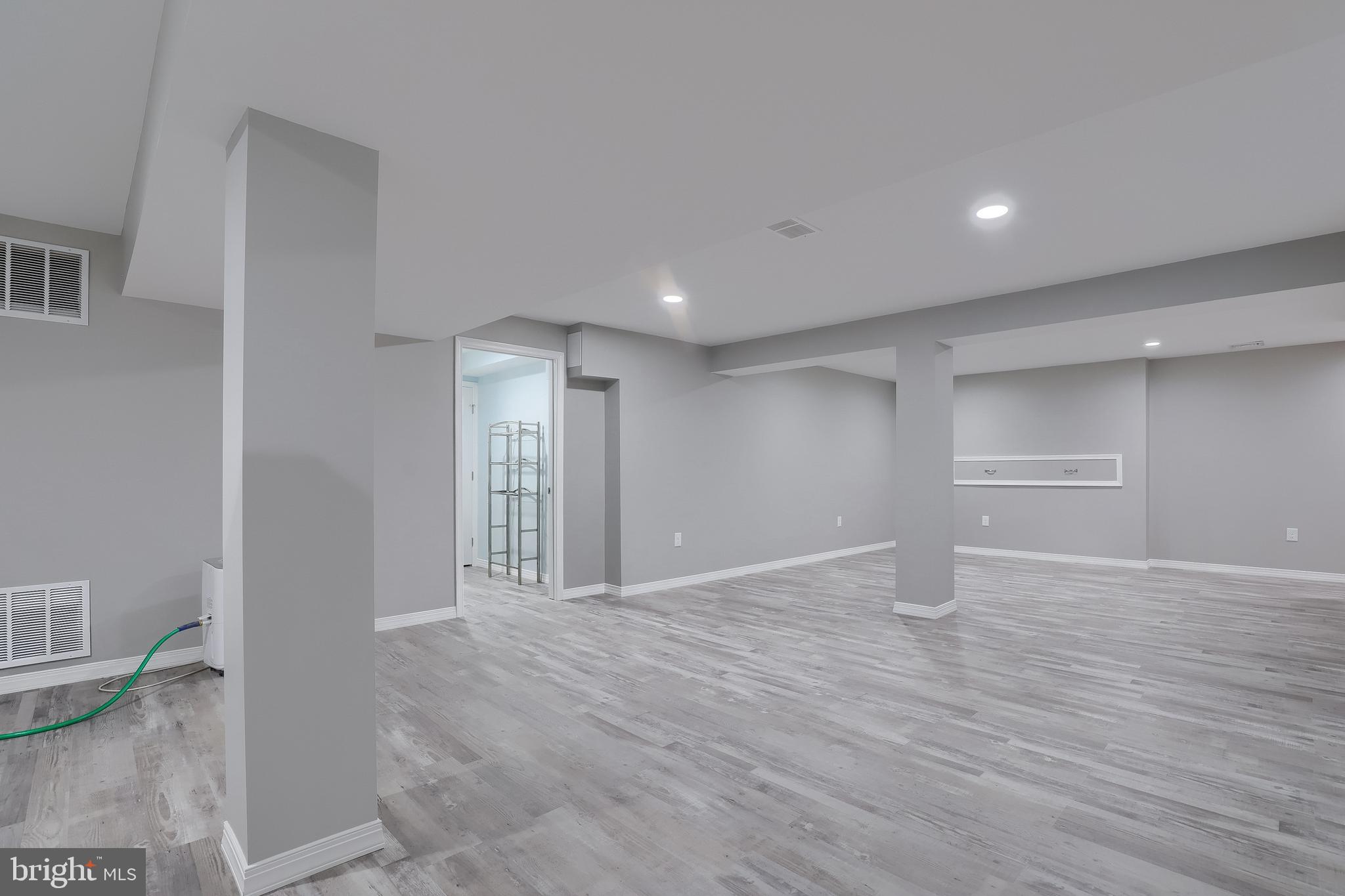 430 Wagonwheel Road Lititz, PA 17543 - Photo 43 of 51 a view of an empty room with wooden floor and a window