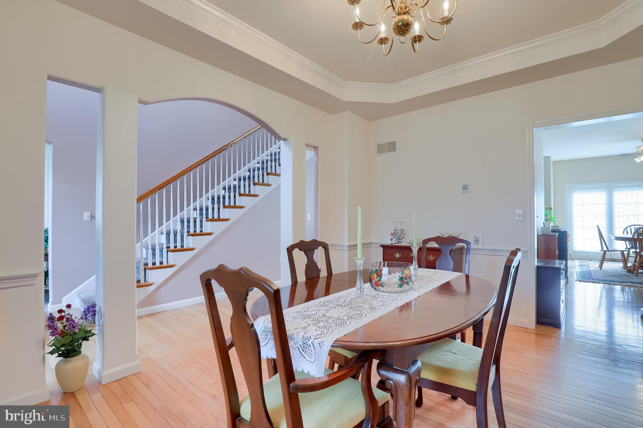 430 Wagonwheel Road Lititz, PA 17543 - Photo 9 of 51 a view of a dining room with furniture and wooden floor