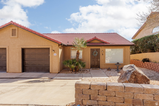 161 West 950 South, Unit S4 St. George, UT 84770 - Photo 3 of 21 Mediterranean / spanish-style house with a garage, a tiled roof, stucco siding, and driveway