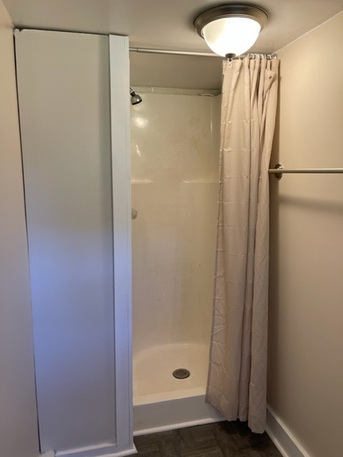 301 Bennett Street Decherd, TN 37324 - Photo 32 of 41 a bathroom with a glass shower door and a sink