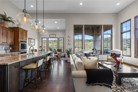 a very nice looking living room with furniture and a large window