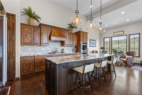 a kitchen with stainless steel appliances granite countertop counter space a sink and cabinets