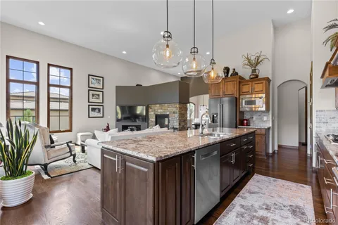 a dining table with chairs and wooden floor