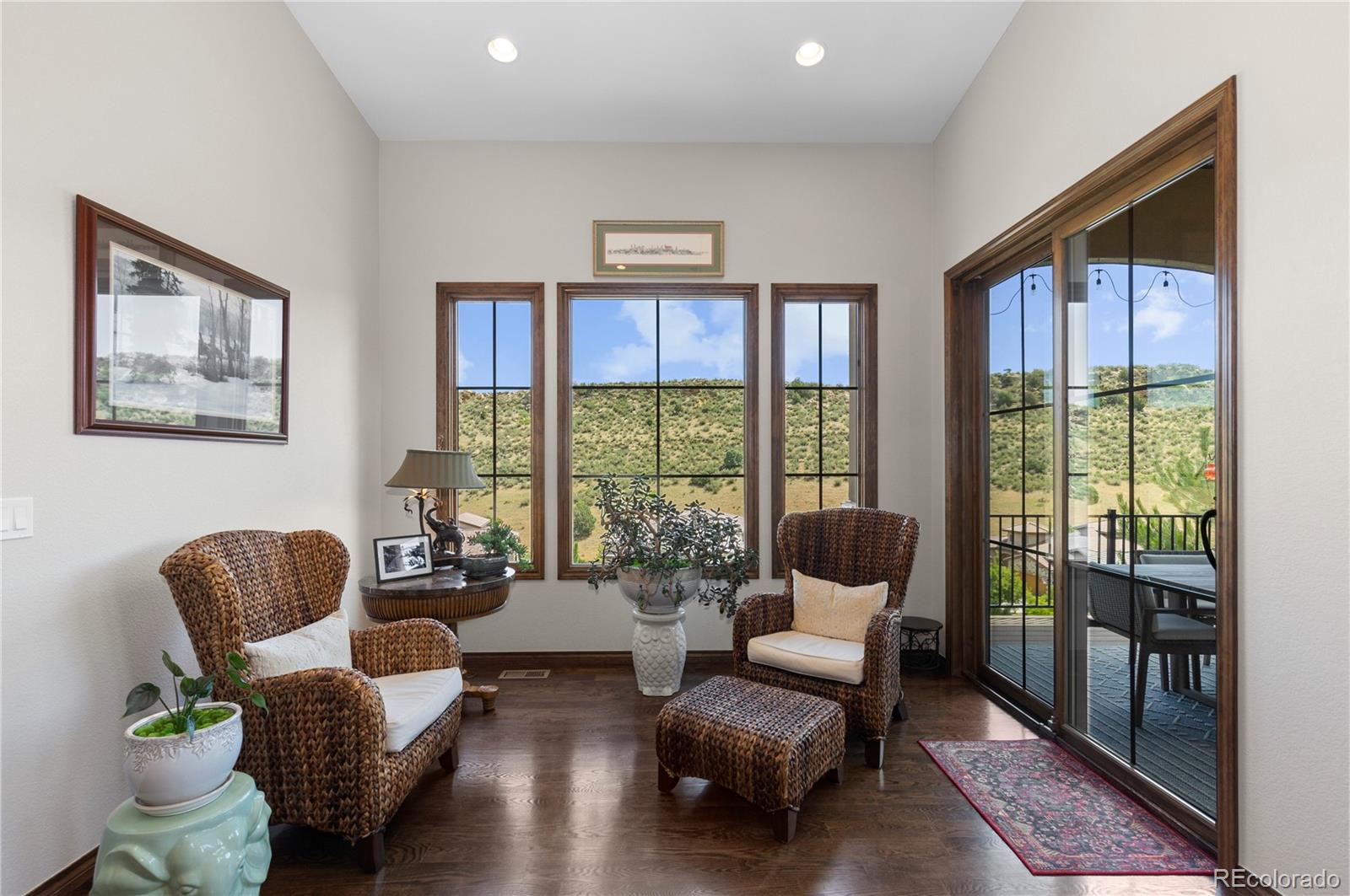 8000 Raphael Lane Littleton, CO 80125 - Photo 18 of 47 a living room with furniture and a large window