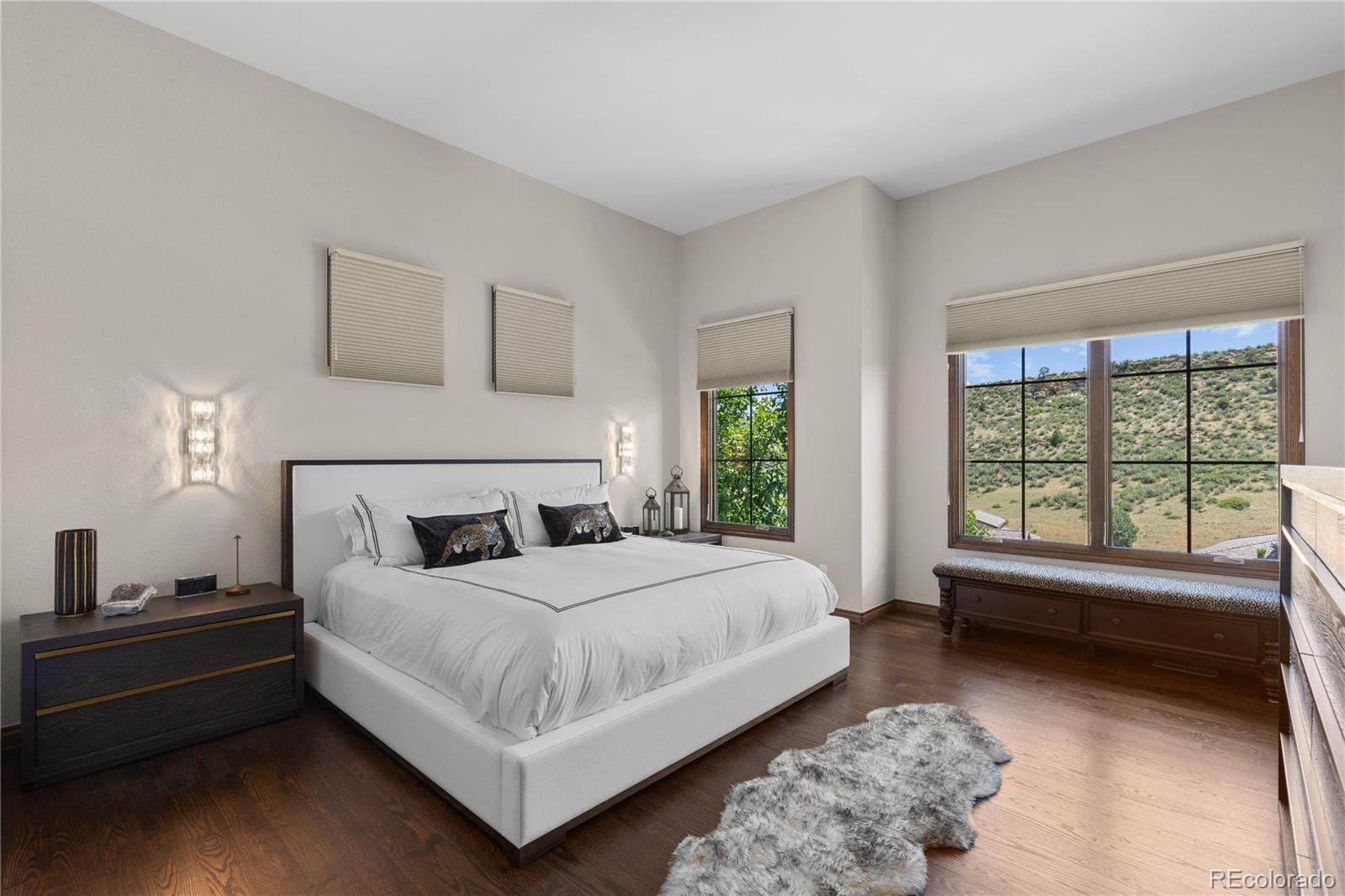 8000 Raphael Lane Littleton, CO 80125 - Photo 20 of 47 a bedroom with a bed and a large window