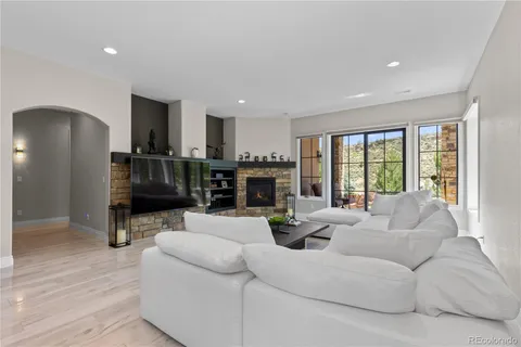 a living room with furniture and a fireplace