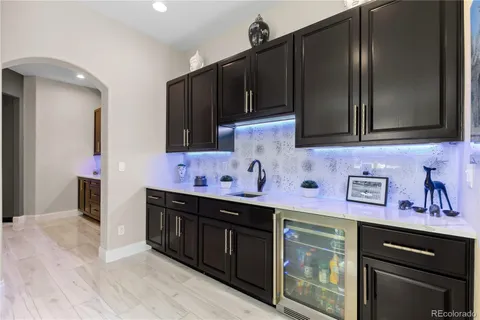 a kitchen with stainless steel appliances a sink cabinets and a microwave