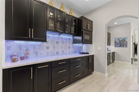 a kitchen with stainless steel appliances granite countertop wooden cabinets and granite counter tops