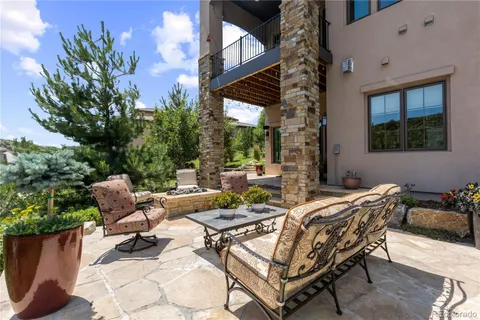 a view of a patio with a table and chairs in patio