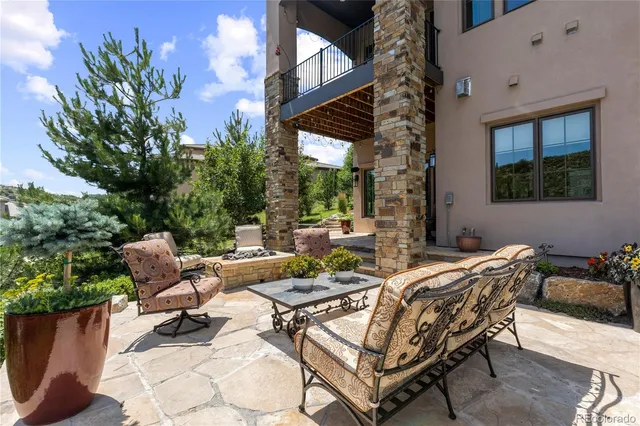 a view of a patio with a table and chairs in patio
