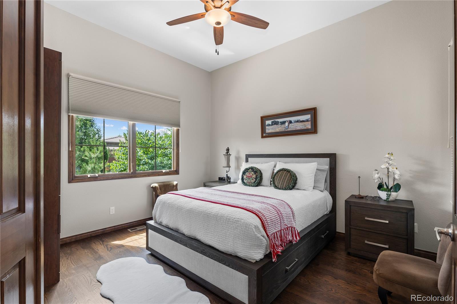 8000 Raphael Lane Littleton, CO 80125 - Photo 5 of 47 a bedroom with a bed and a large window