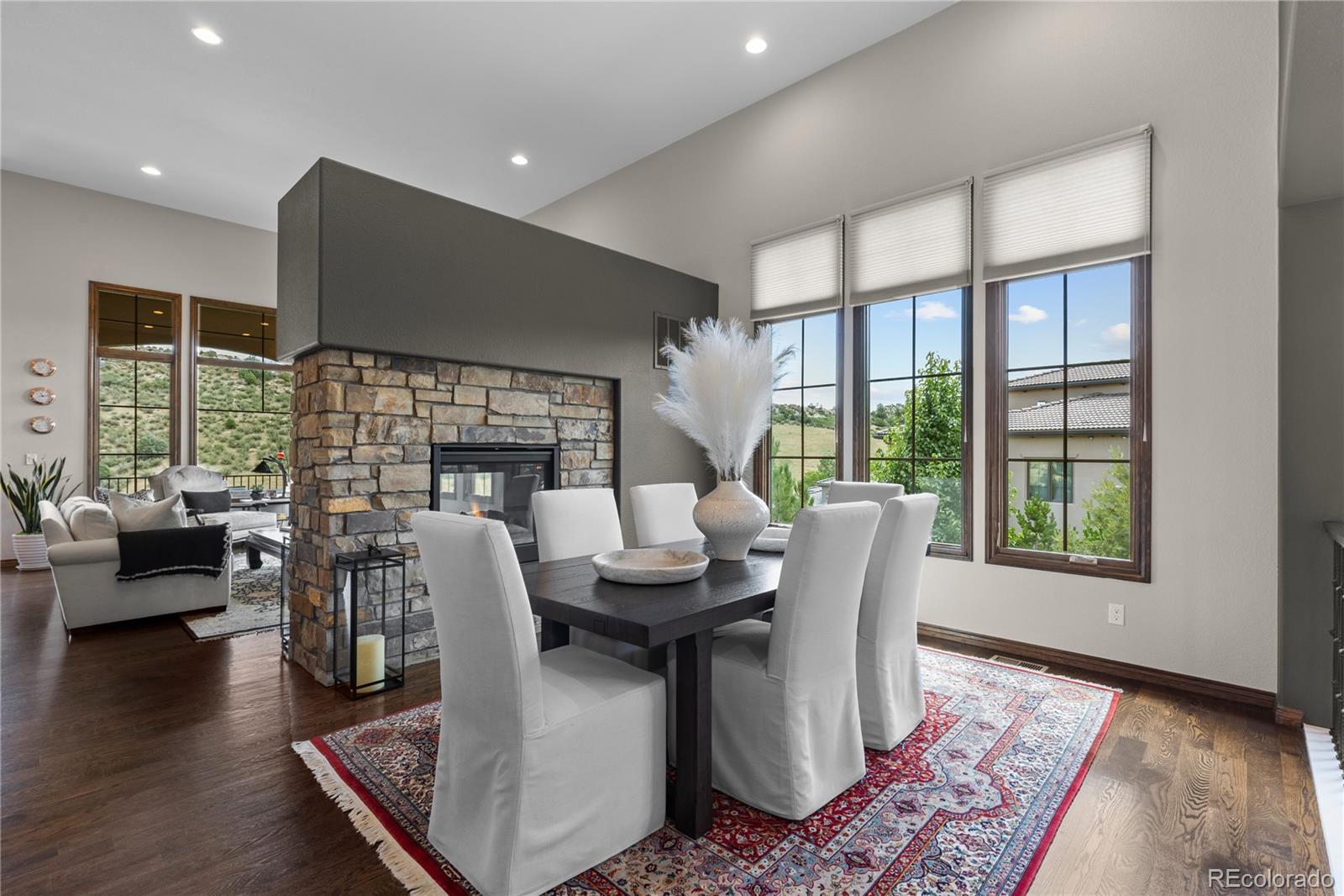 8000 Raphael Lane Littleton, CO 80125 - Photo 7 of 47 a living room with fireplace furniture and a floor to ceiling window