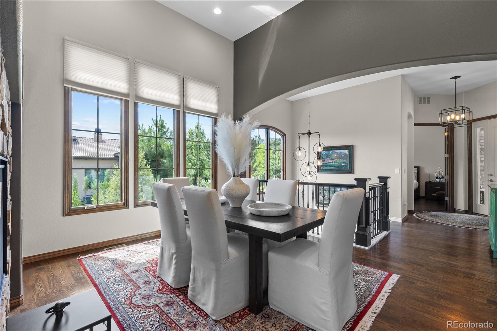 8000 Raphael Lane Littleton, CO 80125 - Photo 9 of 47 a dining room with furniture window wooden floor