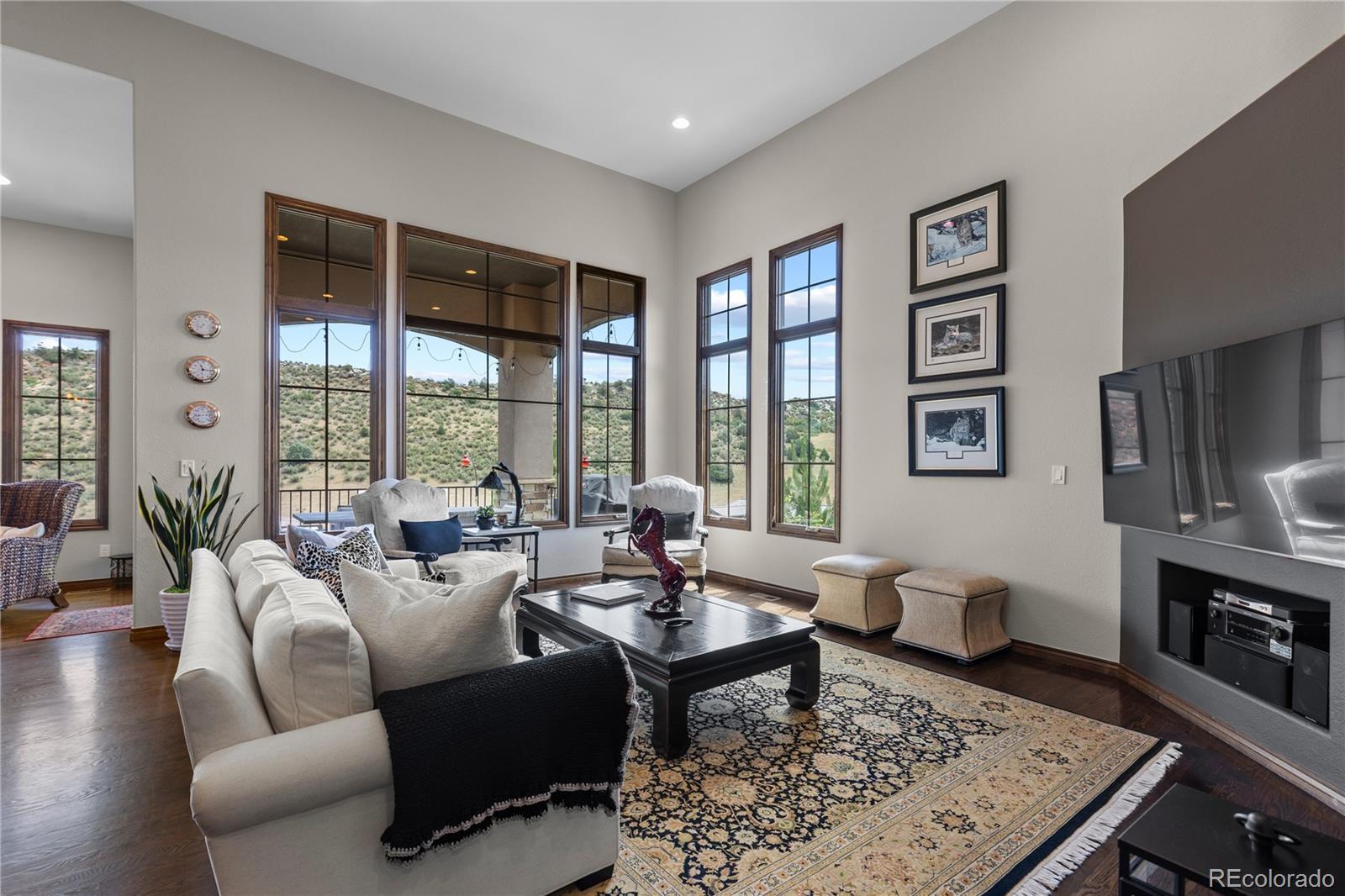 8000 Raphael Lane Littleton, CO 80125 - Photo 10 of 47 a living room with furniture large window and a table