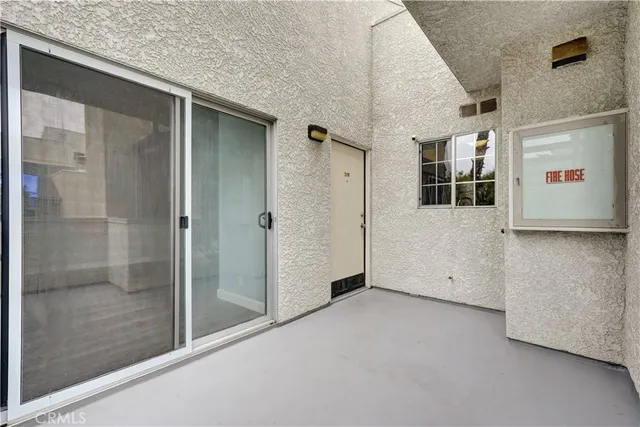 a view of a hallway with a bathroom