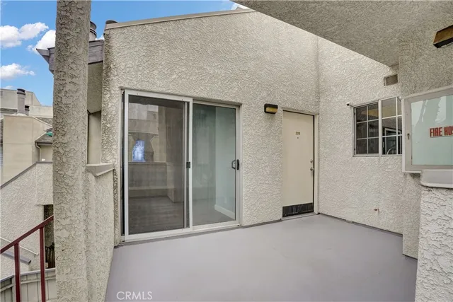a view of a brick house with a glass door