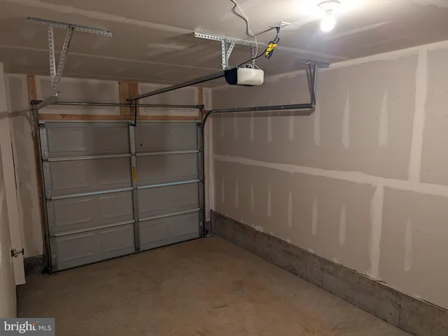 a view of an empty room with a fan