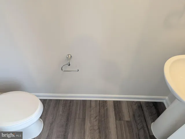a bathroom with a toilet and a sink