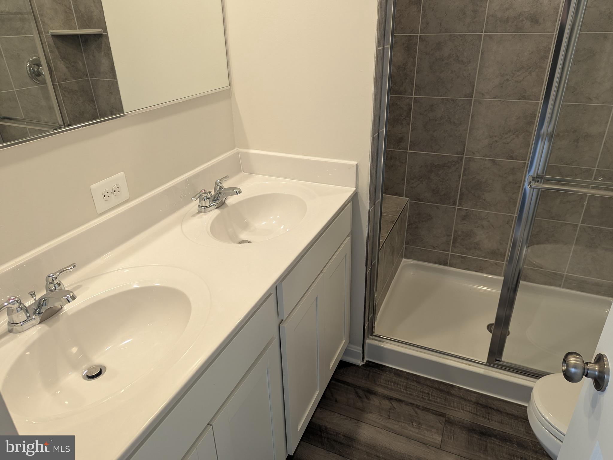 513 Seeback Drive Charles Town, WV 25414 - Photo 26 of 33 a bathroom with a sink and a tub