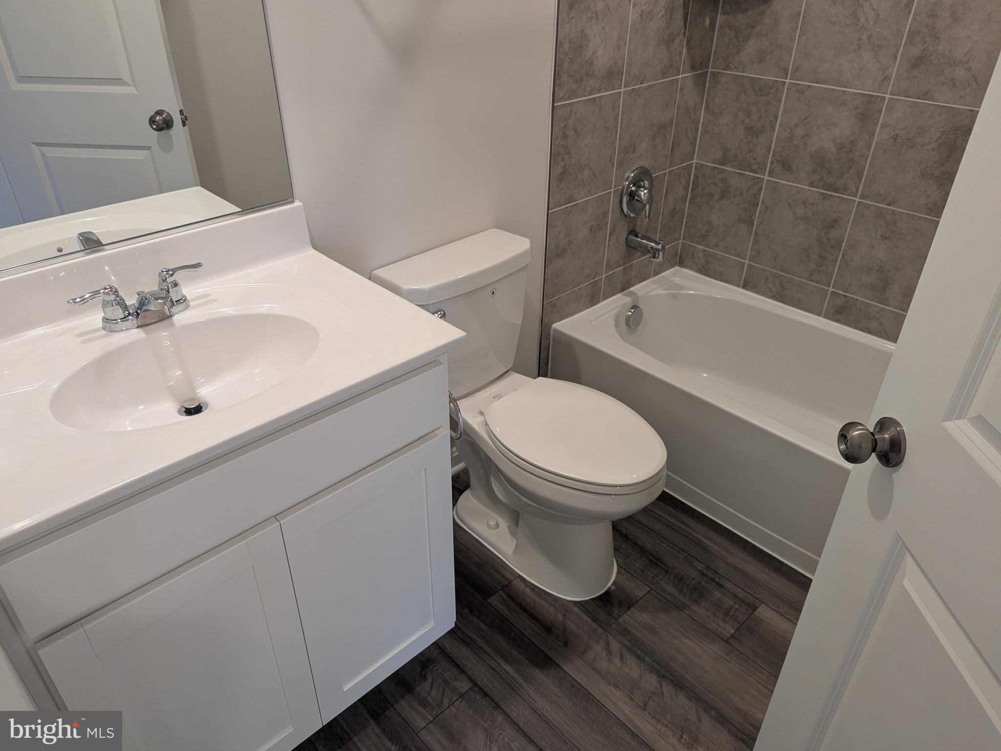 513 Seeback Drive Charles Town, WV 25414 - Photo 32 of 33 a bathroom with a sink toilet and shower