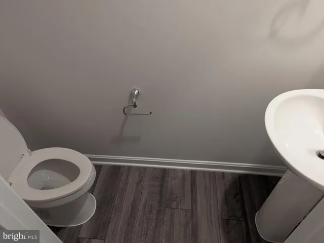 a bathroom with a toilet and a sink