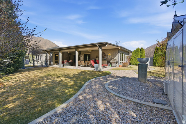 145 Carnesecca Court Mapleton, UT 84664 - Photo 88 of 109 Rear view of house featuring a patio, a ceiling fan, and stucco siding