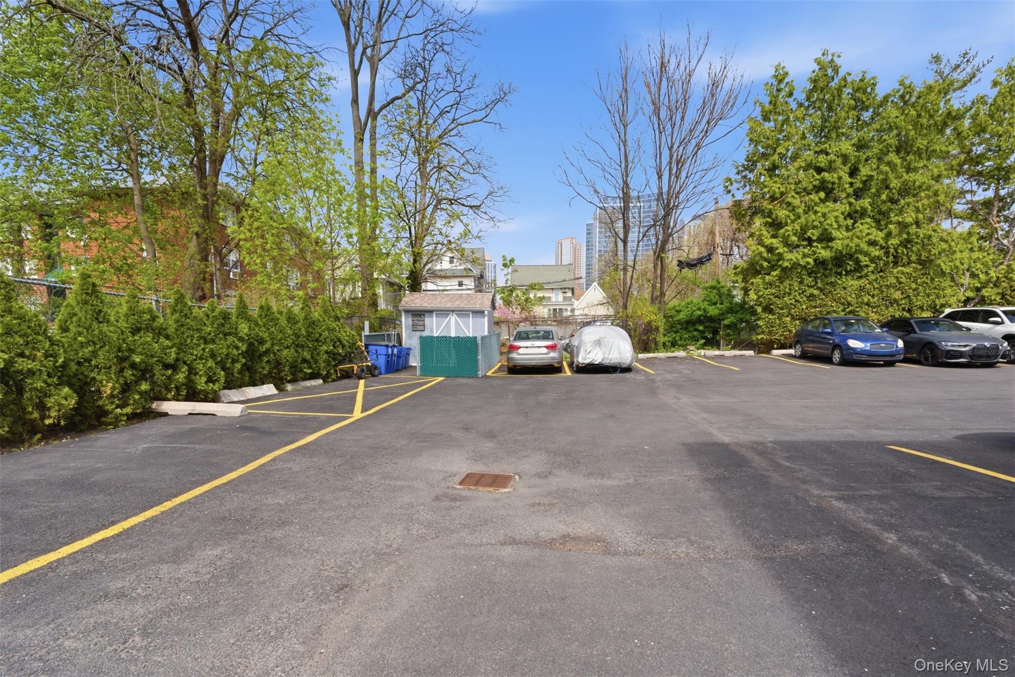 25 Trinity Place, Unit 2K New Rochelle, NY 10805 - Photo 22 of 25 Paved parking area- unit comes with one deeded parking spot.